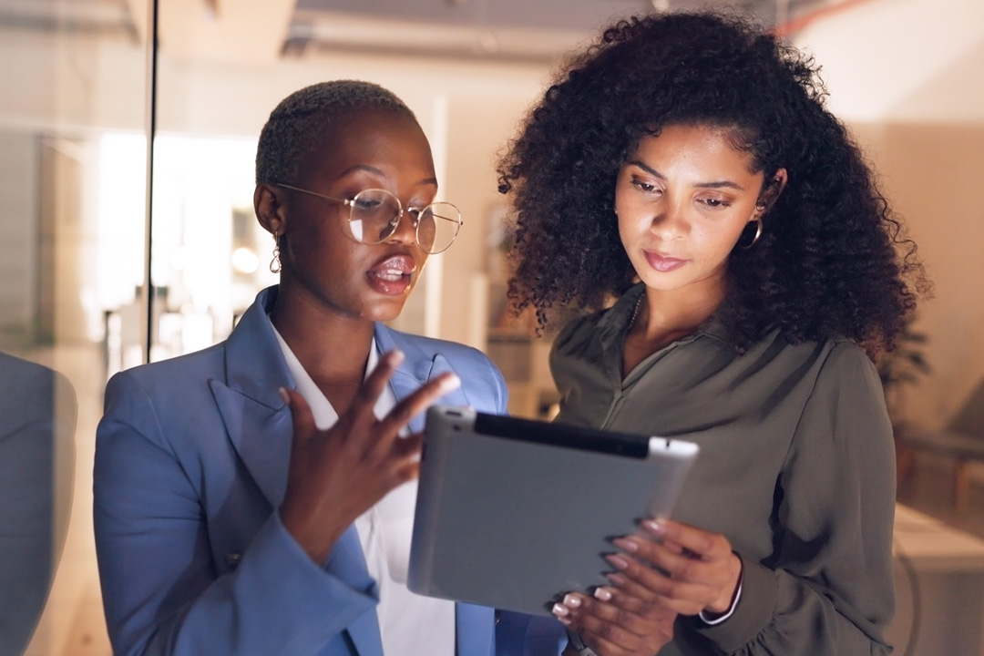 Women in office looking at tablet